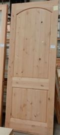 Knotty Alder door with arch & 2 grooved panels