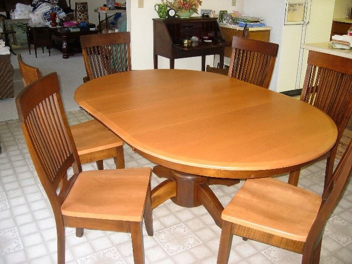 like new pedestal dining set with 6 chairs, leaf originally purchased for 2600.00 