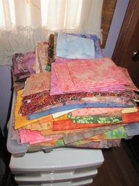 LOTS AND LOTS OF FABRIC, SHE WAS A HUGE QUILTER AND WE HAVE ROOMS OF FABRIC TO GO THRU, ALL NICE AND CLEAN