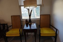 Cool pair of chairs and that nifty lamp (there is a pair) has 2 mini bulbs tucked in those leaves, that give it some real mid-century flair!