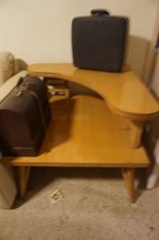 Blurry pix of mid-century table-same leg and manufacturer as the one in previous pix with plate glass shelf, vintage sewing machine and typewriter