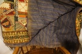 The back of the quilt and another needlepoint patch-this one is a butterfly