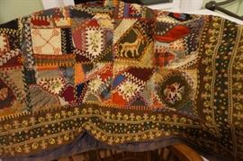 How cool is this QUILT!  The edge is hand embroidered and there are needlepoint patches throughout.  There is a goat and some flowers in this one.