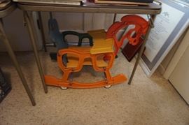 Unusual children's rocking horse, colorful, on wheeels
