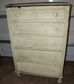 Shabby little chest of drawers, waiting for someone to work their refinishing magic.