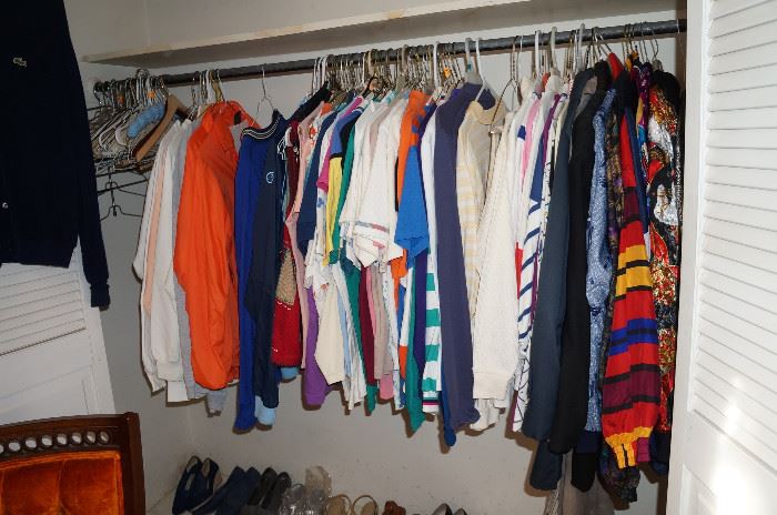 The closets are packed with men's and ladies' clothing.