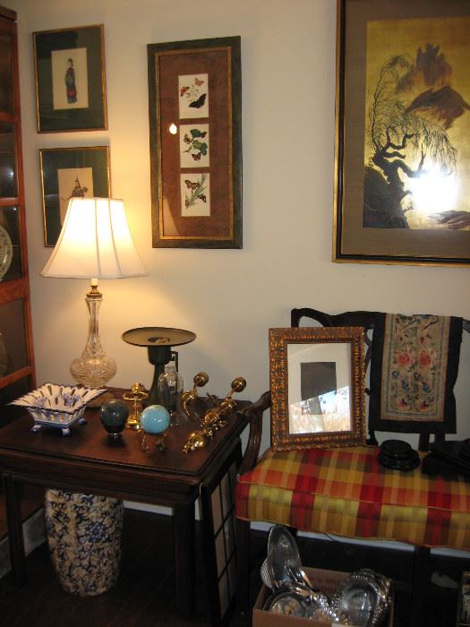 There are many Asian style framed art prints all throughout the house. Small to large. Also lots of small Asian influenced decorative items from small porcelain figurines to cloisonné vases . 