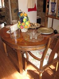 Asian styled dining room table with two leaves. It's a great size for smaller dining rooms 