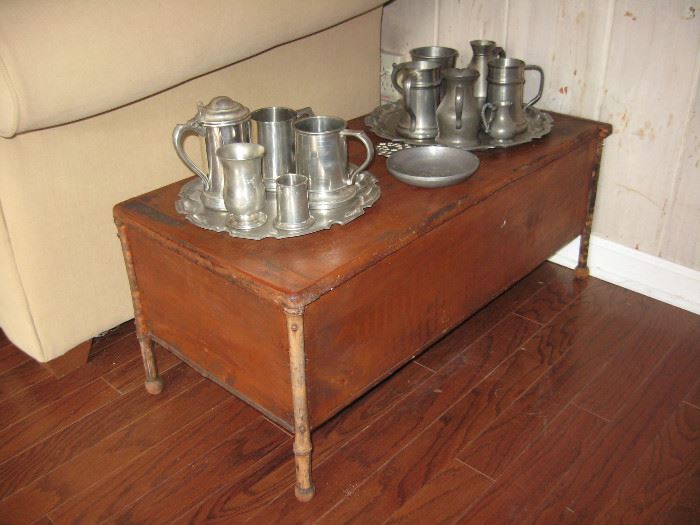 Antique small footed trunk , pewter trays, pitchers and tankards 