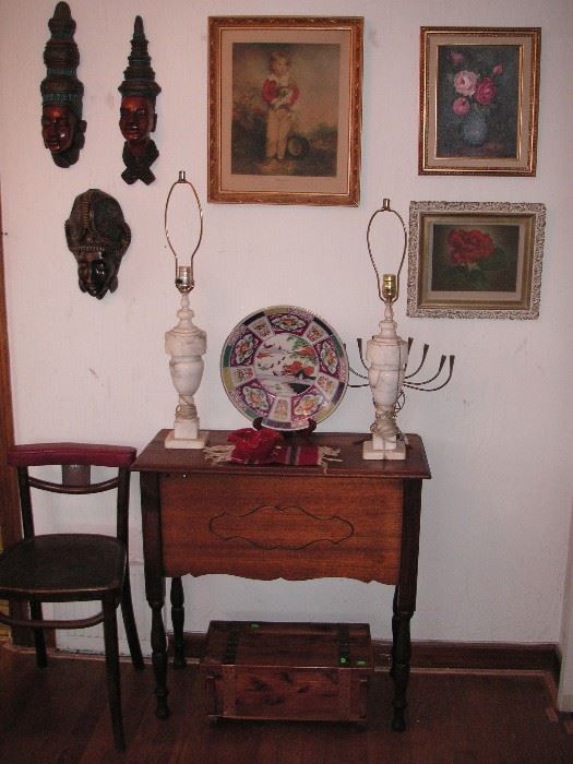 Table with shelf on back side; vintage restaurant chair; Bali masks