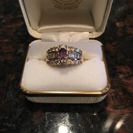 18 ct. gold Alexandrite and diamond ring.  18 round diamonds/12 baggets.  ASK to see this ring.