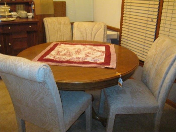Round Table and four of the six fabric chairs