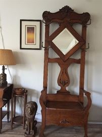 Closer View of Oak Hall Tree.  Cement Lion