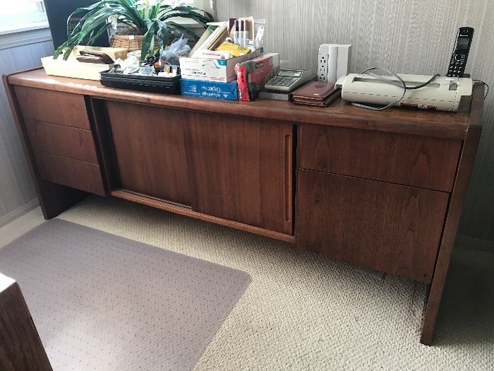 Mid Century Modern console side cabinet - three drawers on either side of a two-door sliding door cabinet space