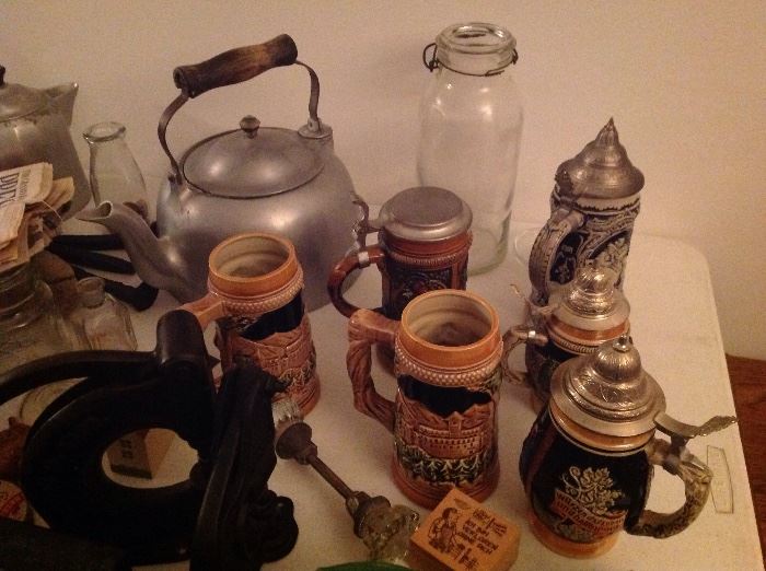 Beer steins, glass ware, old tools, tins etc...