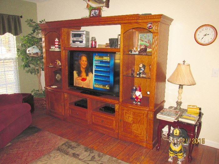 TV STAND, WILL SEPARATE TO MOVE, HAS LOTS OF STORAGE SPACE FOR FIGURINES, BOOKS, ETC.