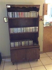Book case and large collection of CDs. 