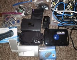 Electronics, iGo full travel kit with accessory tips, Card Scan, Portable USB HUB, Waterproof wireless speaker brand new, Tons of memory cards, tons of USB drives, tape cassette recorder, DirecTV boxes, Brand new never used Camera Filters that had fit the Canon G3X, Lots of cords, phone, electronic, etc.