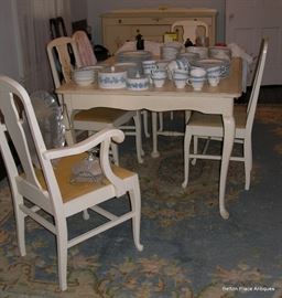 Provincial Dining Table and Chairs, one foot on the table is split and would need reglued