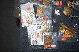 Tom Mix Badges with six gun on them  