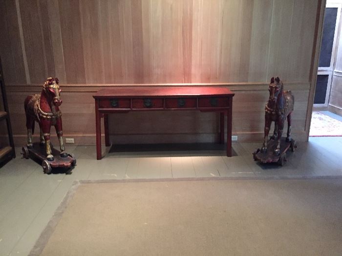 Pair of carved wooden horses and an antique Asian sideboard