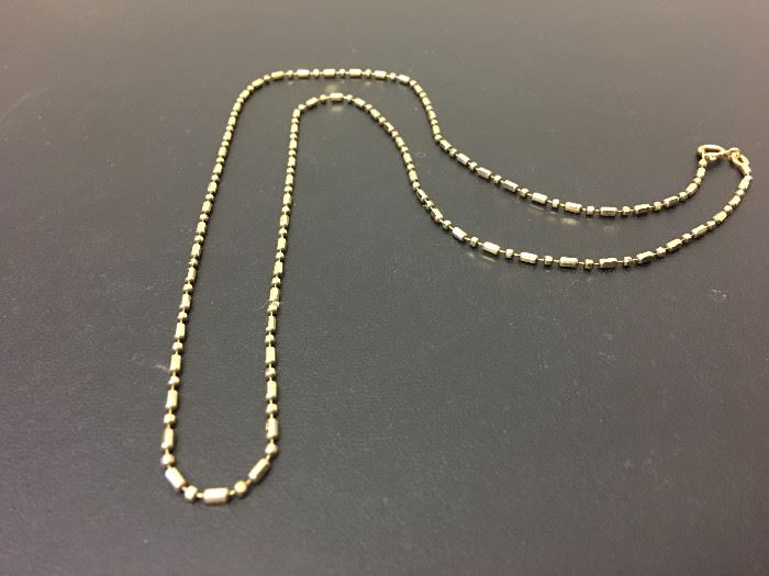 Gold "Bar & Ball" Fashion Neck Chain.  14k yellow gold, 22" long, "bar & ball" style neck chain.  It is accented with a spring ring closure.  Description & appraisal by:  Peter Naughter, G.G., A.G.S., Gemology Laboratory Oct 2016.  Fair market value is $150.00