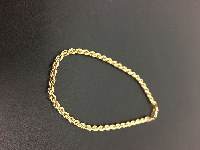Gold Rope Style Bracelet-14k yellow gold, 8" long, fashion bracelet designed in a rope motif.  Description and appraisal by:  Peter Naughter, G.G., A.G.S. Gemological Laboratory Oct 2016.  Fair market value $225.00