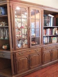 Thomasville wall units in dining room.  There are 4 pieces - glass doors on curio