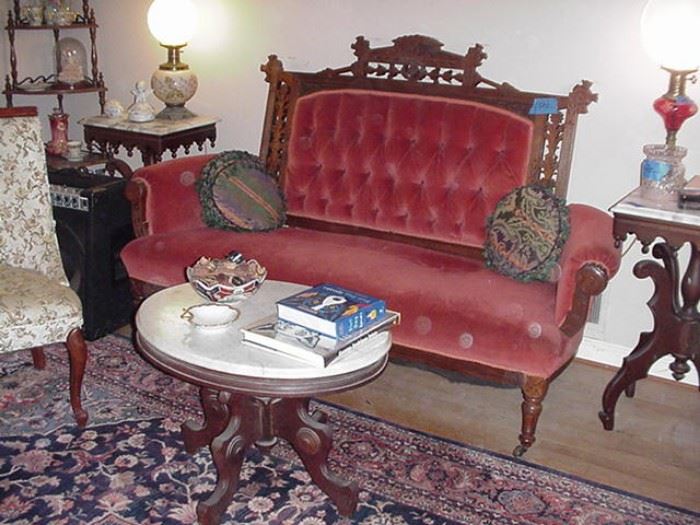 Another view of the Victorian settee and marble top tables