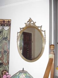 Oval mirror, gold-leaf frame