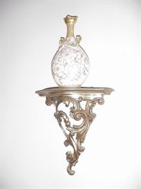 Ornate wood sconce and hand-paiinted vase