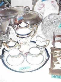 Germany hand-painted teaset with tray, coffee pot, cream and sugar, and two demitasse cups and saucers--reserves of courting couples on each piece,also rose bowl in cut glass, carved panel, Art Nouveau period, silverplated serving pieces, and more