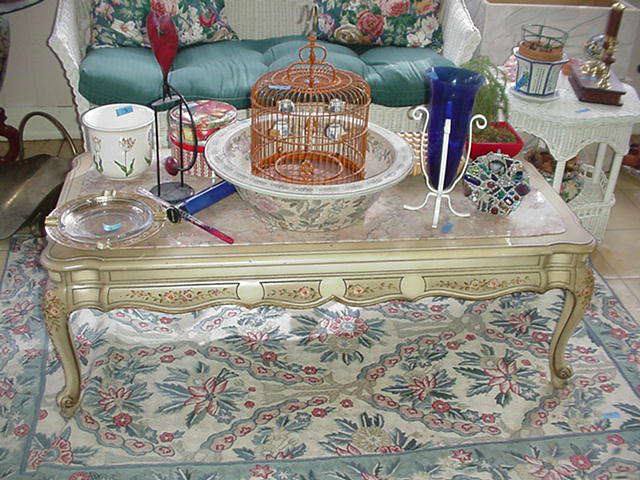 French style coffee table with marble insert and needlepoint rug