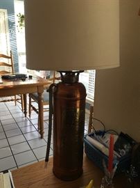  Taken from a Boy Scouts office in the 1950s. It was stripped of its red paint and made into a lamp.  This fire  extinguisher lamp is made of copper.