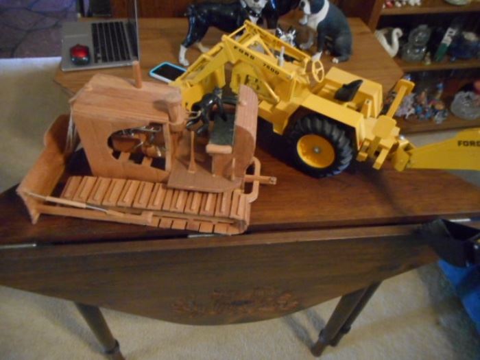 Ford model tractor and wooden bulldozer