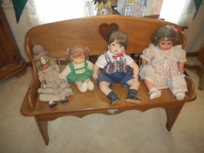 Porcelain dolls and heart bench