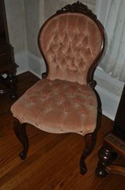 One of two antique side chairs
