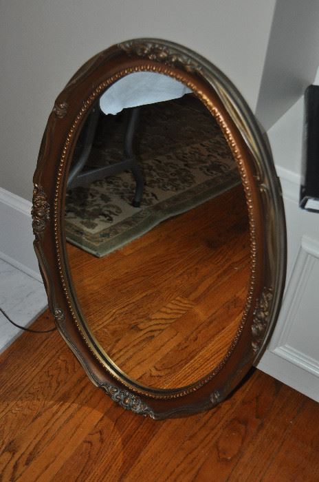 One of two oval mirrors