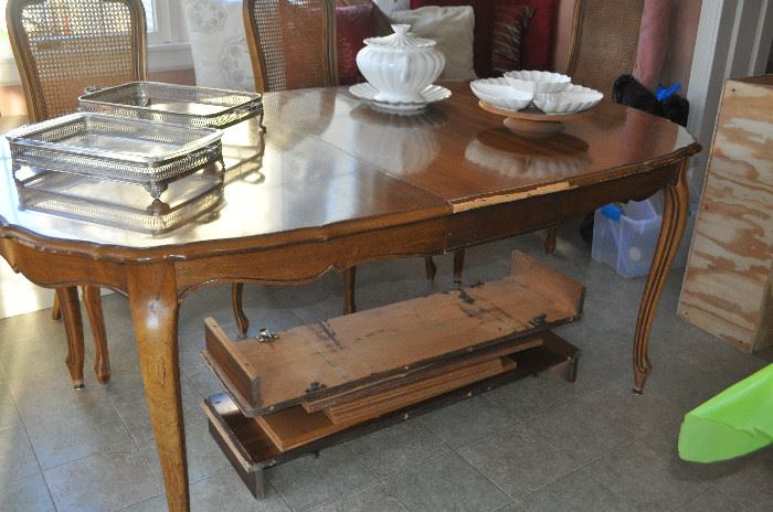 Dining table with extra leaves and four chairs