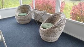 Outdoor woven seats with cushions and covers (not shown)