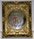 23. RENAISSANCE REVIVAL CARVED AND GILTWOOD MIRROR