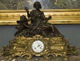 185. FRENCH BRONZE AND GILT BRONZE FIGURAL MANTEL CLOCK