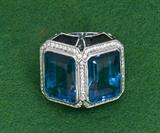 302. EIGHTEEN KARAT WHITE GOLD, DIAMOND, AND BLUE TOPAZ RING