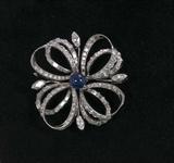 303. PLATINUM, DIAMOND, AND SAPPHIRE BROOCH