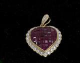 308. EIGHTEEN KARAT YELLOW GOLD, DIAMOND, AND RUBY HEART PENDANT