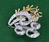 309. PLATINUM, EIGHTEEN KARAT YELLOW GOLD, AND PAVE DIAMOND MID-CENTURY BROOCH