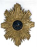 32O. FRENCH BONZE AND ENAMELED SUNBURST CLOCK