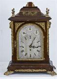 407. GERMAN MAHOGANY AND GILT METAL BRACKET CLOCK
