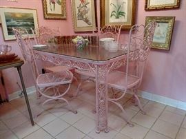 Ornate wrought iron table and chairs