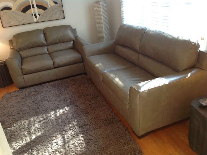 Ashley Leather Loveseat and Sofa set - Sofa - 84" wide x 37" deep x 38" tall - gray.  Loveseat 60" wide x 37" deep x 38" tall - gray.  Both in very good condition.  Sofa $ 350.00, Loveseat $ 250.00.